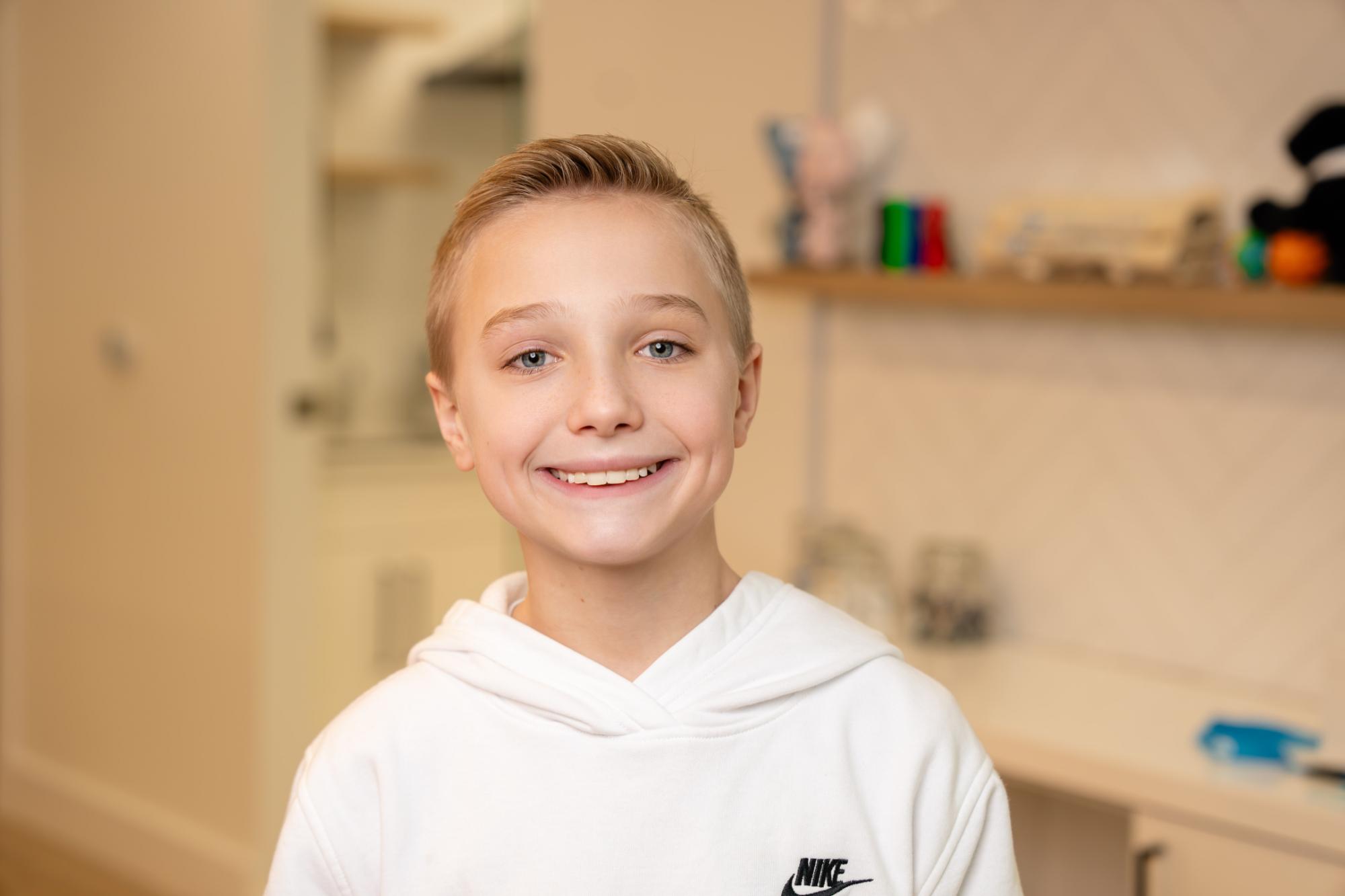 child smiling with braces