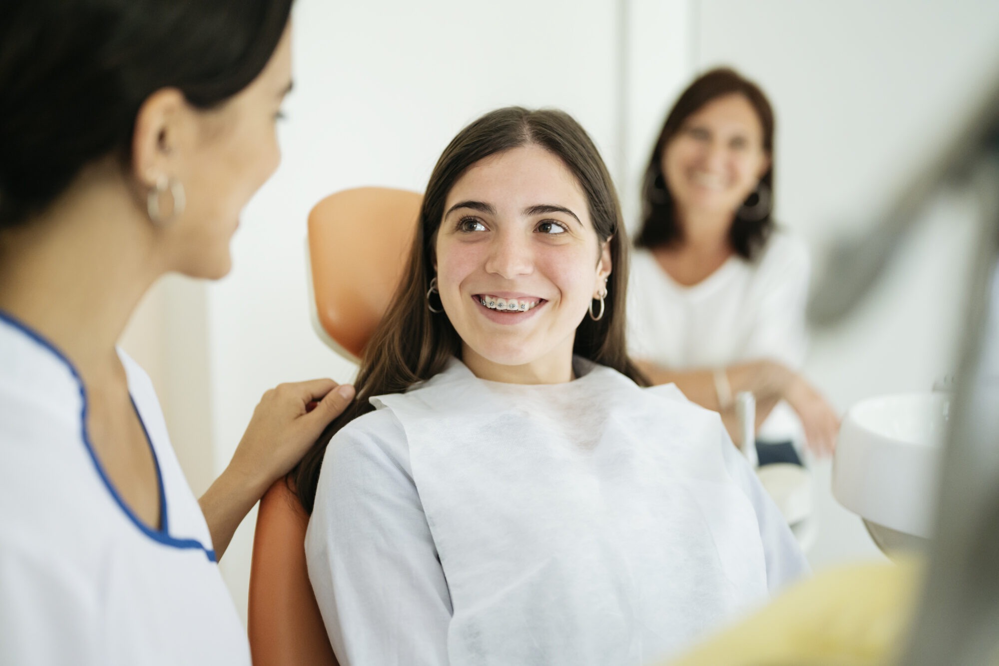 teen smiling during orthodontic visit