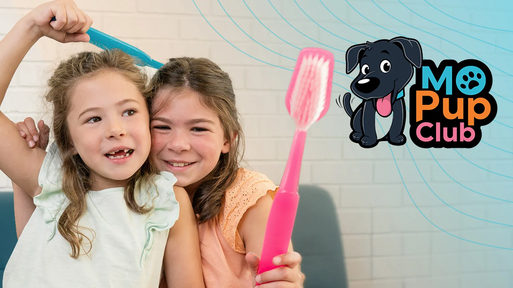 Two smiling girls holding giant toothbrushes next to the MO Pup Club logo