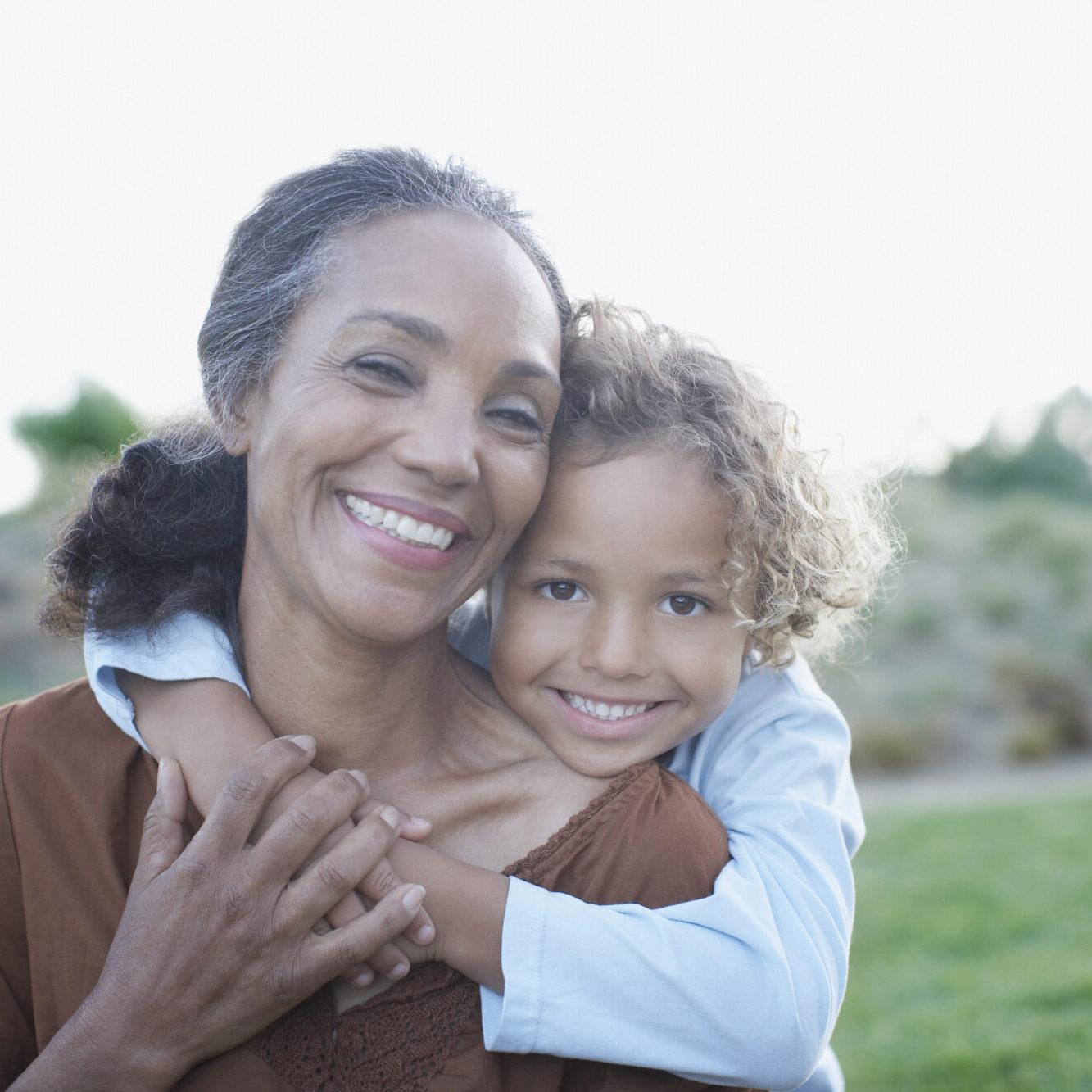 Boy hugging grandmother